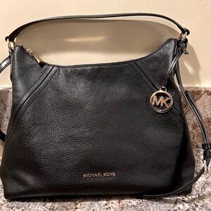 Authentic Michael kors black pebbled handbag/crossbody strap